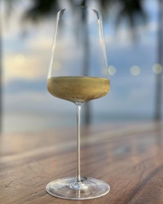 Did you know that Mauritius produces exquisite litchi wine? Savoring the sunset in Mauritius with Tillman Glass Universal....